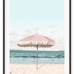 A natural wall art with a pink umbrella on the summer beach in Bali pastel tones and boho style