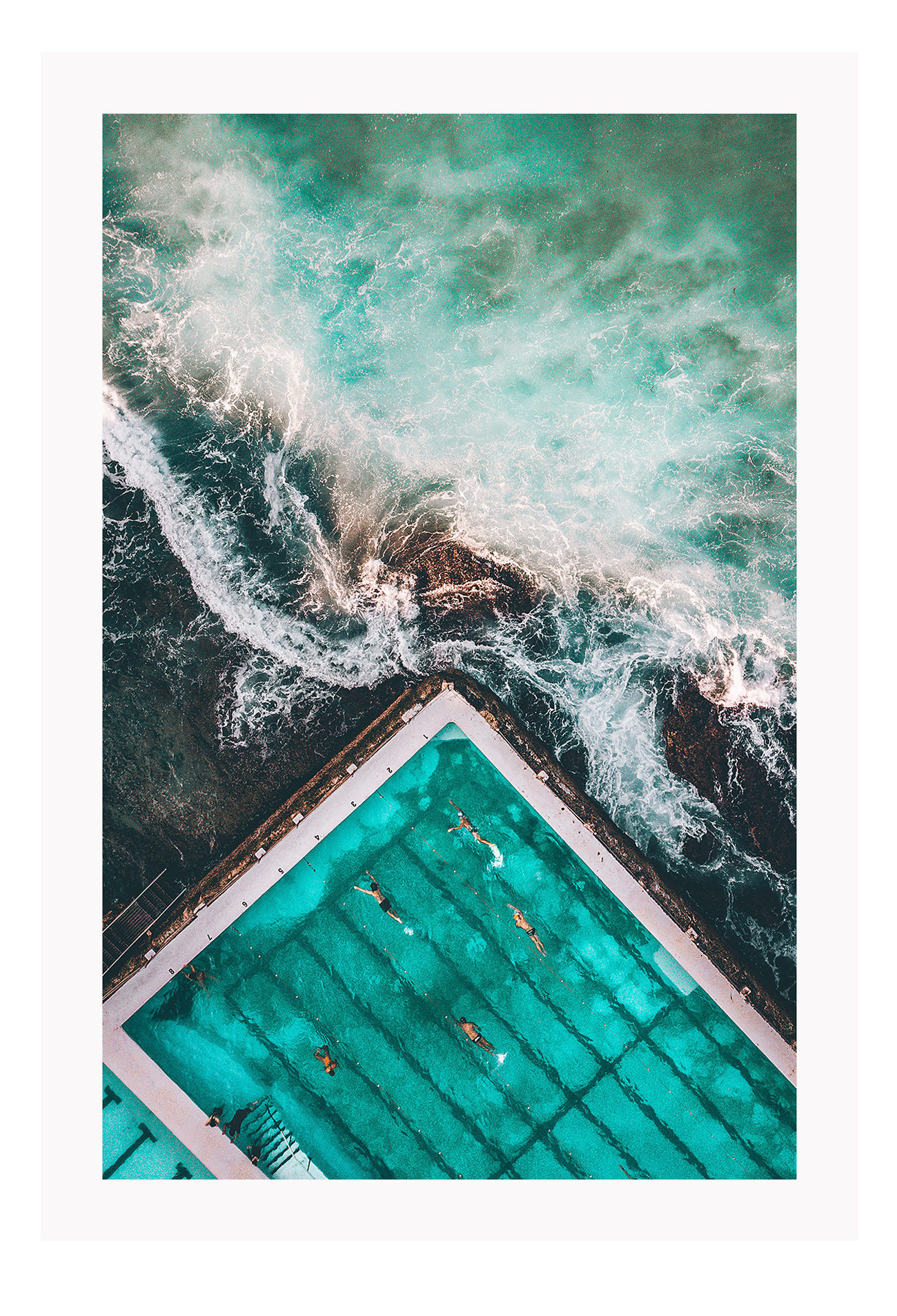 An ocean wall art with a blue and green water sea with famous iceberg swimming pool in Bondi, Sydney, Australia