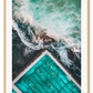 An ocean wall art with a blue and green water sea with famous iceberg swimming pool in Bondi, Sydney, Australia