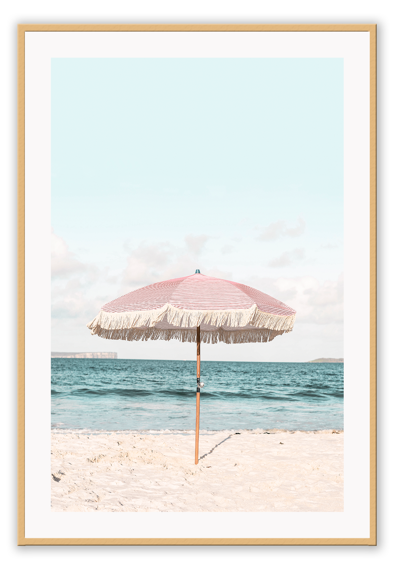 A natural wall art with a pink umbrella on the summer beach in Bali pastel tones and boho style