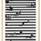 A black and white urban wall art with an aerial view of a busy city street crossing with zebra stripes.