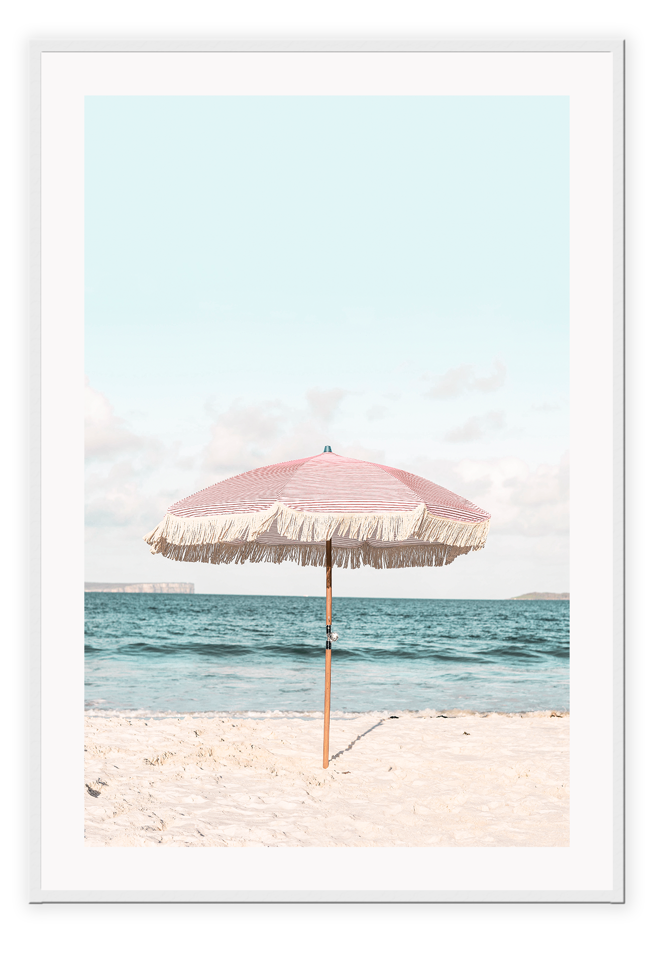 A natural wall art with a pink umbrella on the summer beach in Bali pastel tones and boho style